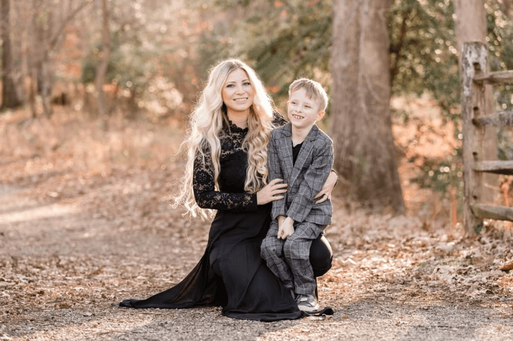 Ashley and her son posing in a park